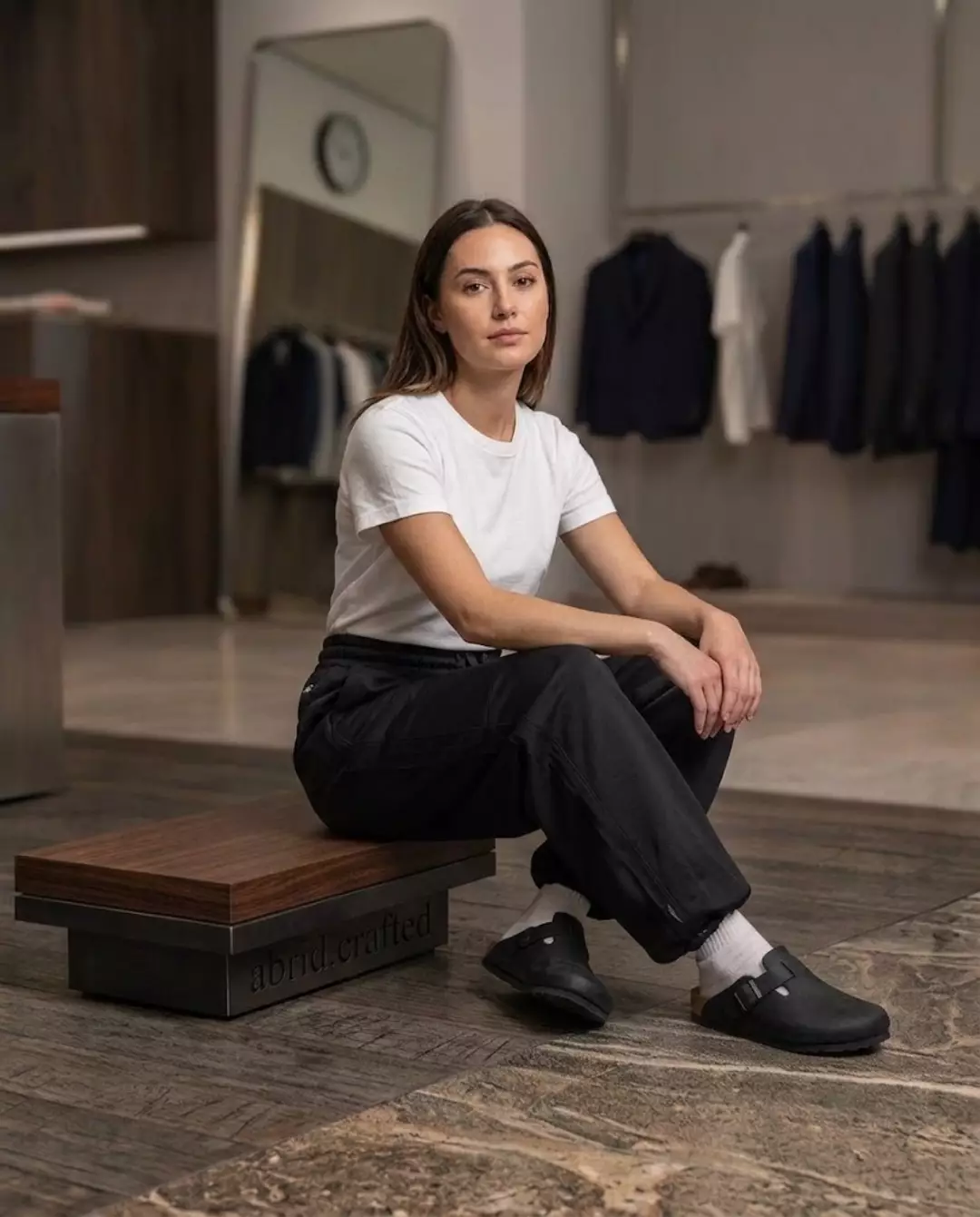 Black clogs worn with black trousers